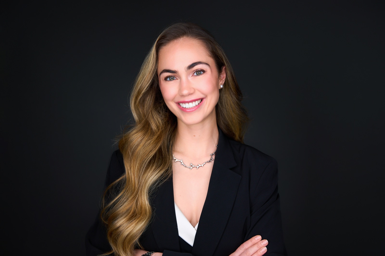 Corporate headshot in a Sydney studio on a dark background